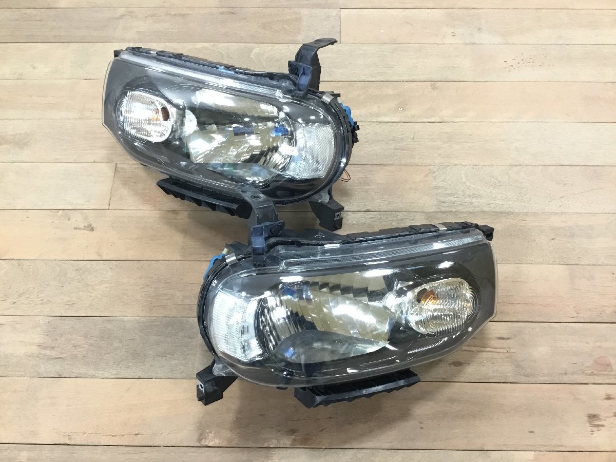 車 キューブ ヘッドライト ハロゲン STANLEY P8190 刻印 ZA