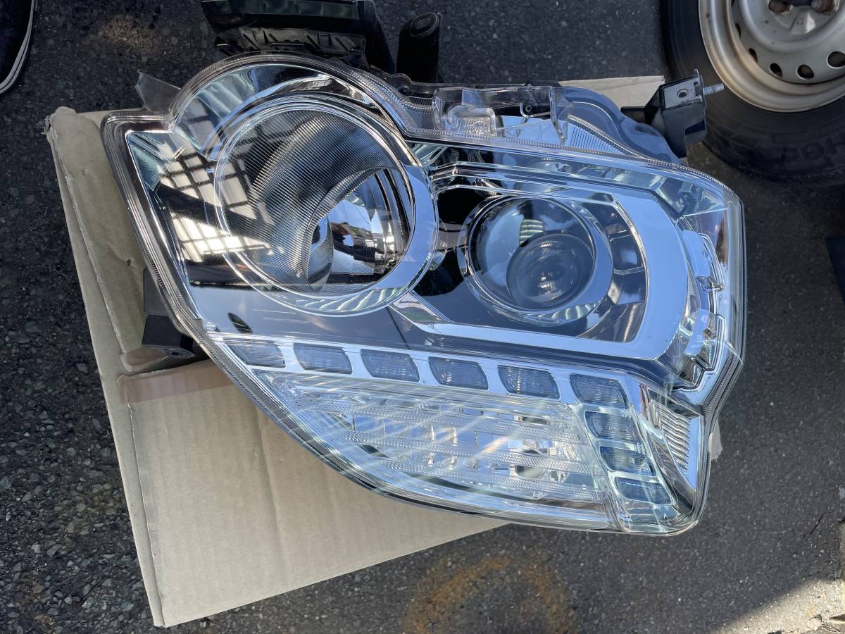 H23 ニッサン エクストレイル NT31 左 ヘッドライト ユニット HID 中古