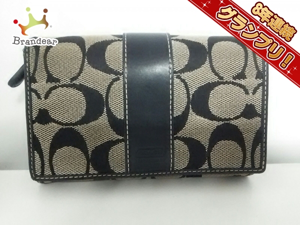 コーチ 2つ折り財布 美品 シグネチャー柄 黒×アイボリー COACH