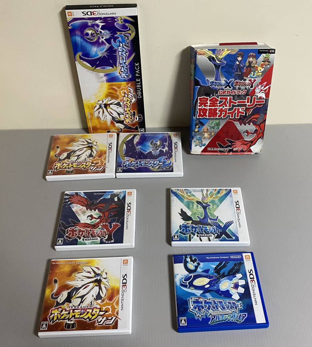任天堂 3DSソフト (ポケモンサンとムーンダブルパック、サン、X、Y、アルファサファイア)計6個＋XY公式ガイドブック　中古品