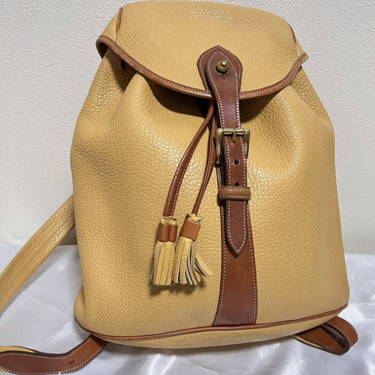DOONEY&BOURKE リュック 巾着型 イエロー チャーム付き ドゥーニー 
