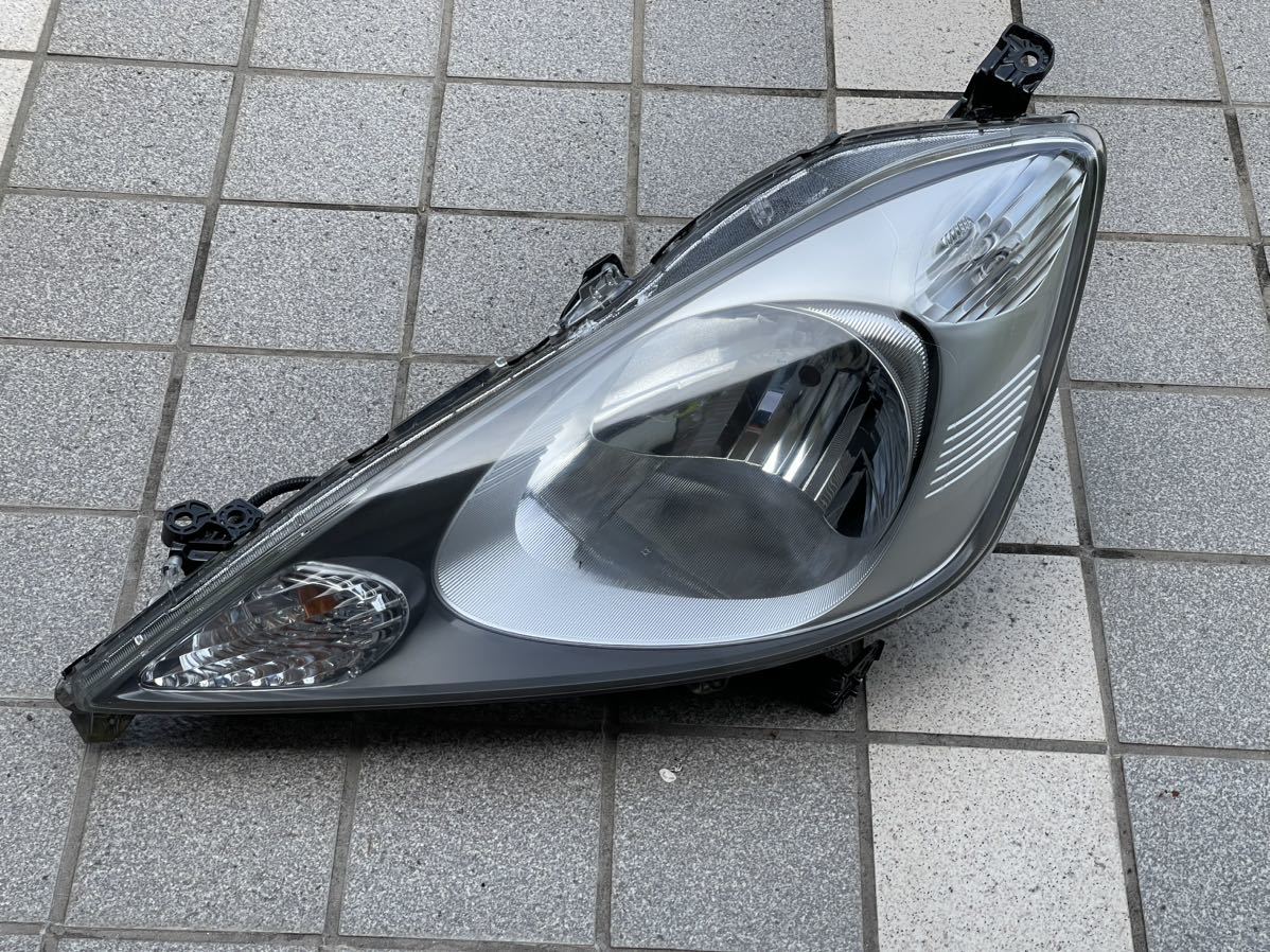 ホンダ フィットGE6 前期　左側ヘッドライト 電動レベライザー 左