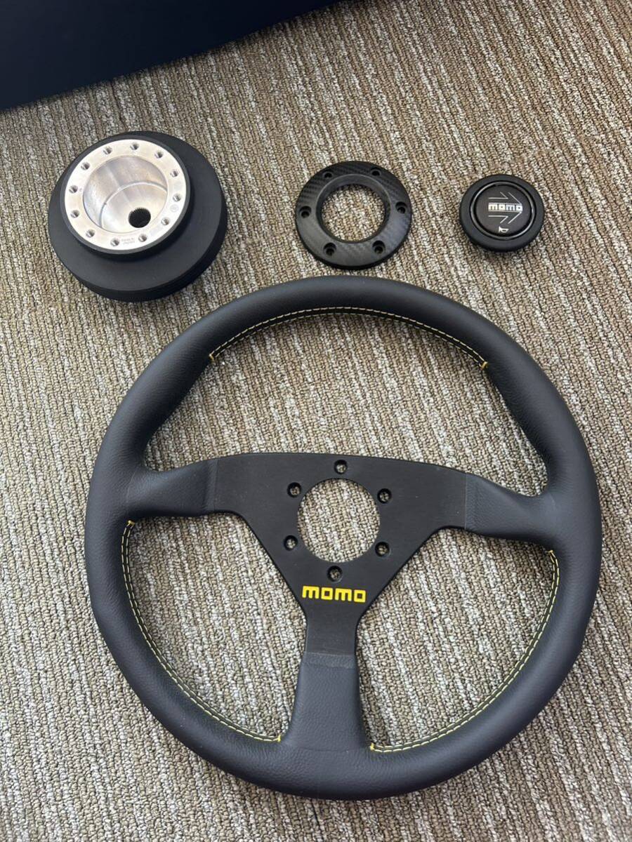 未使用MOMO ステアリング ホーンボタンリングカーボン柄 ワークスベル 