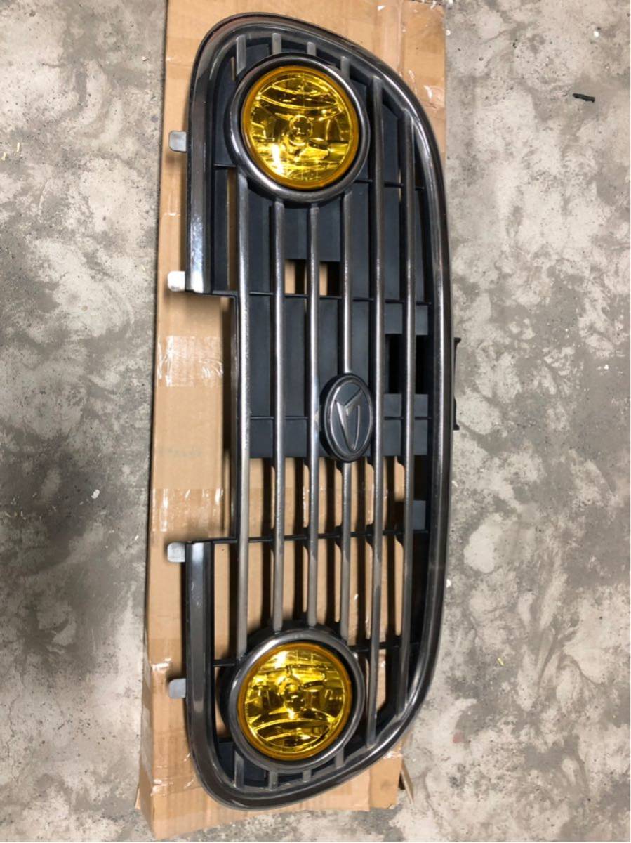 ○：ミラジーノ L700S L710S 純正 フロントグリル フォグランプ 12
