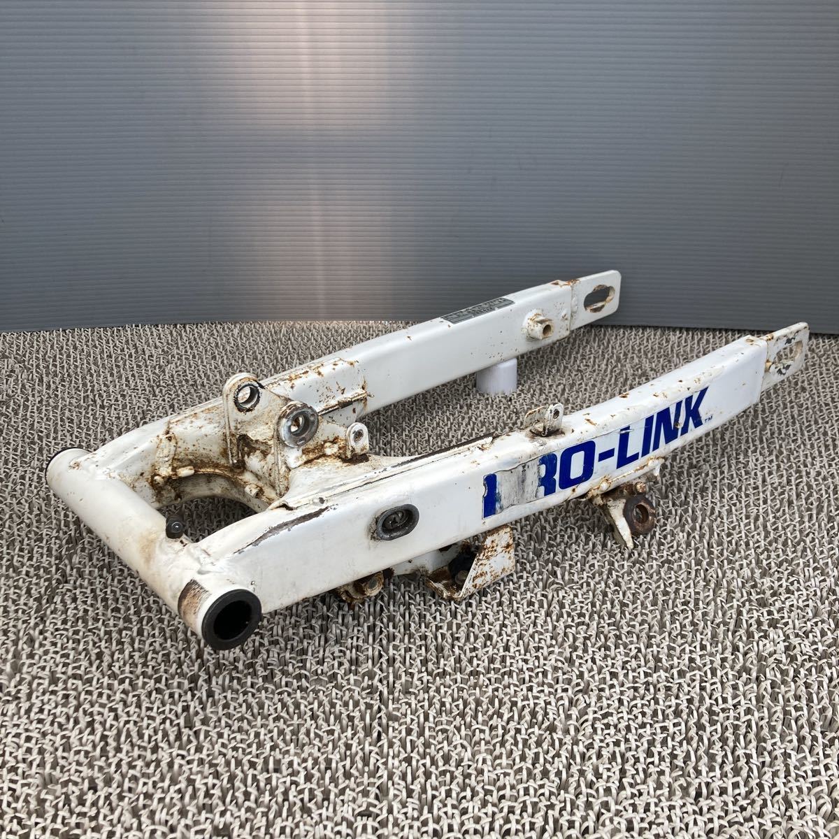 ホンダ TLM200R MD15 スイングアーム チェーンテンショナー 赤 検 純正 