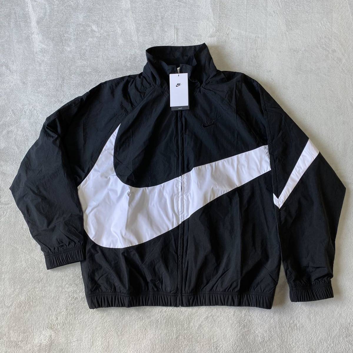 新品 NIKE ナイキ 両面 ビッグスウッシュ BIG SWOOSH ナイロン ジャケット ウィンドブレーカー 黒 ブラック 白 ロゴ刺繍 L
