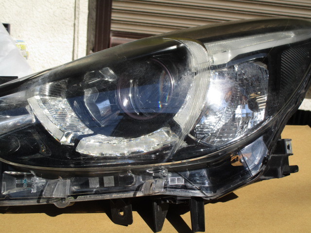 DJ デミオヘッドライト左