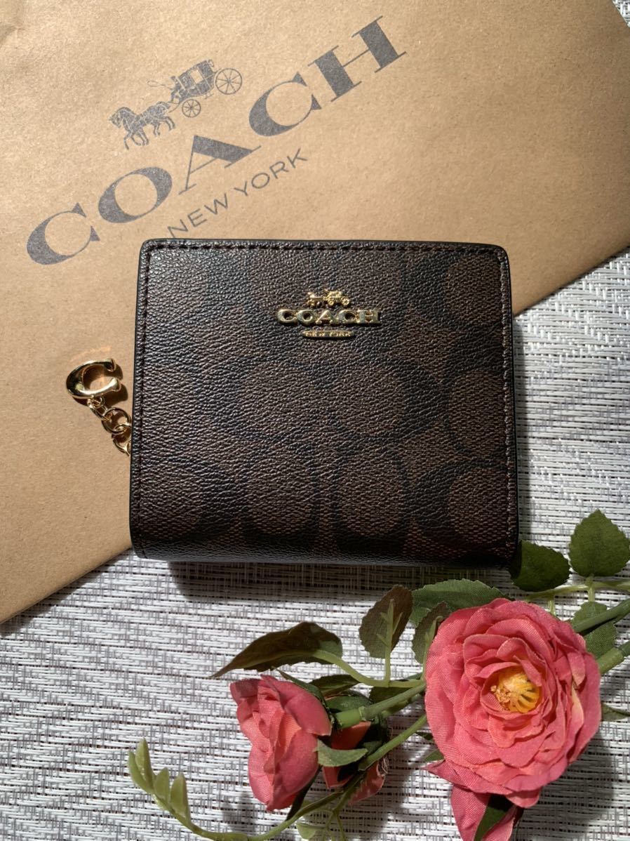 新品COACHシグネチャー二つ折り財布ブラウン