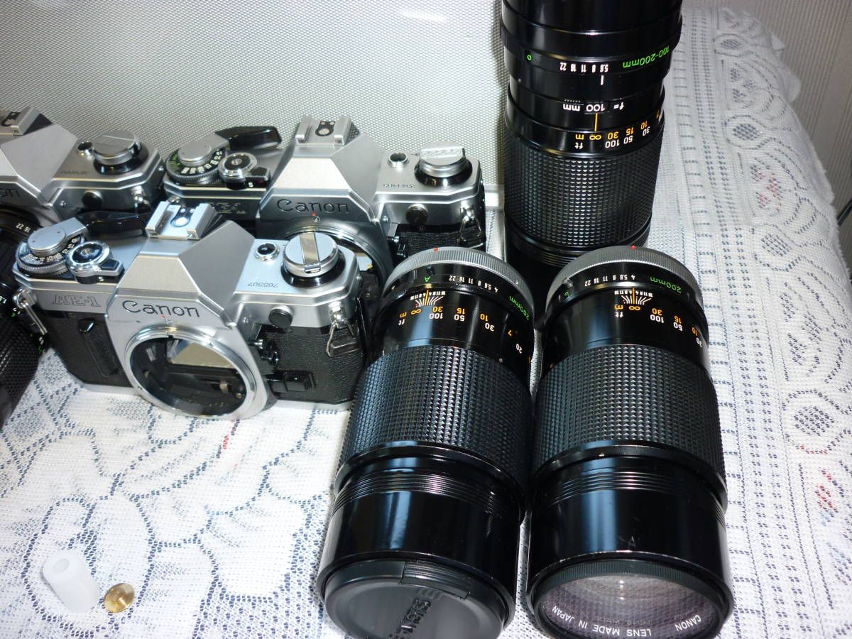 Canon AE-1 フィルム一眼レフカメラ FD 50mm レンズ AE-1 Canon FD 50mm キャノンAE-1（フィルムカメラ）、レンズ3個 工場