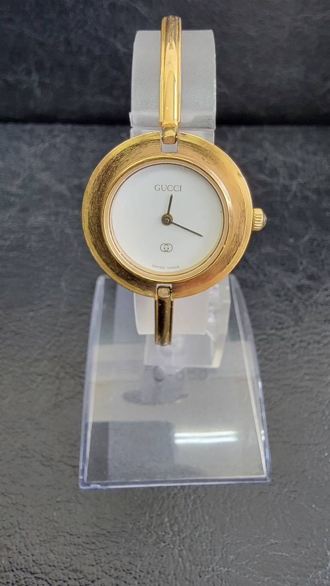 【1円スタート】 GUCCI グッチ チェンジベゼル バングルウォッチクォーツ ゴールドカラー 1100-L 本体のみ レディース腕時計 稼働品