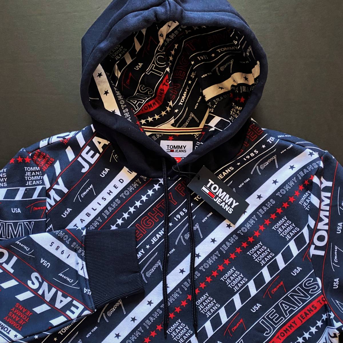 新品USAトミーヒルフィガー TOMMYJEANS総柄スウェットパーカ ネイビー 
