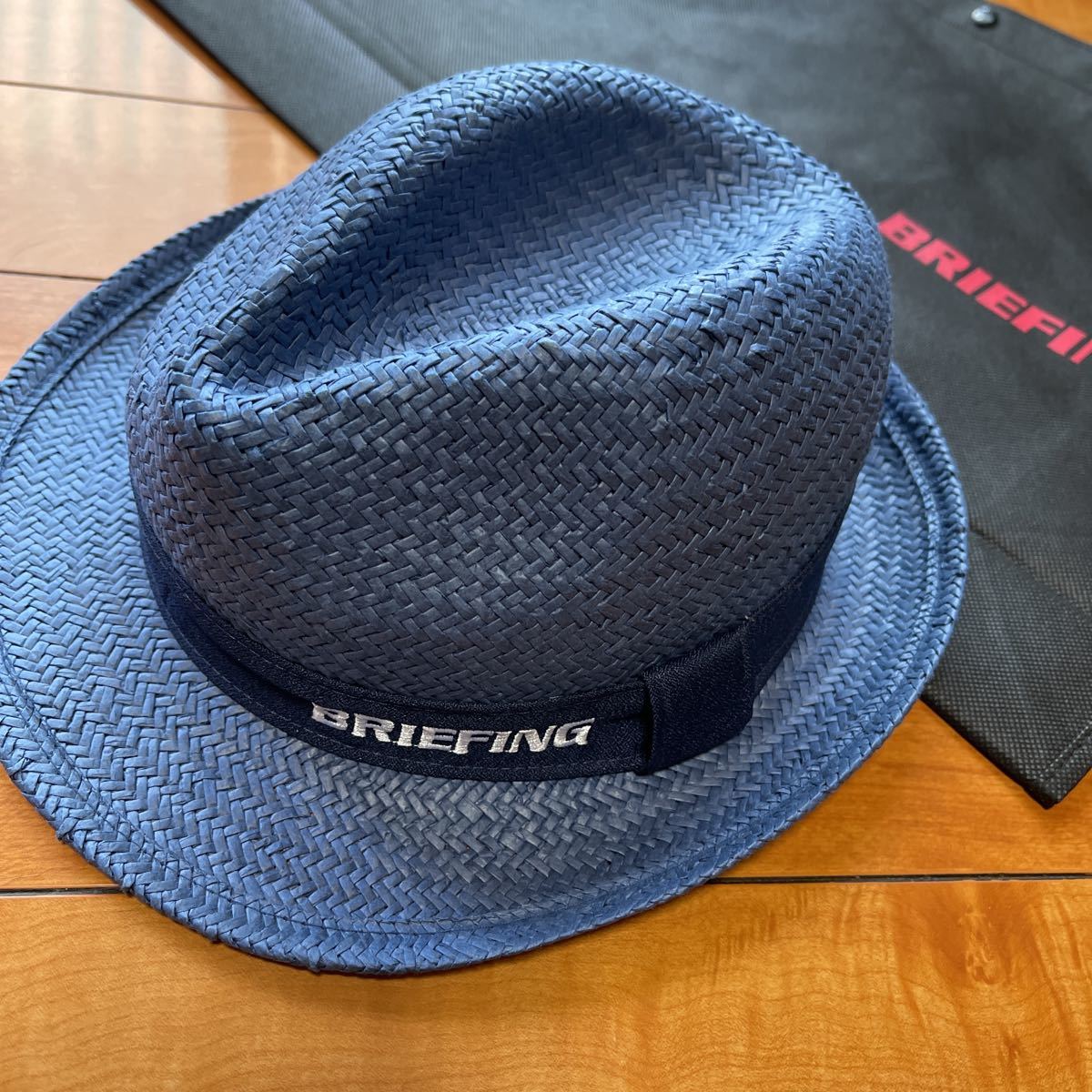 送料無料BRIEFING GOLFブリーフィングSTRAW HAT中折れハット軽量清涼感麦わら帽子風編み上げpaperアジャスター付unisex Navy(M)新品
