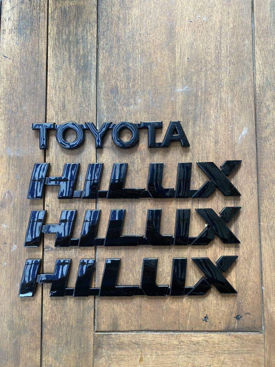 ［送料込み］ハイラックス gun125 ピアノブラック エンブレム 4点セット