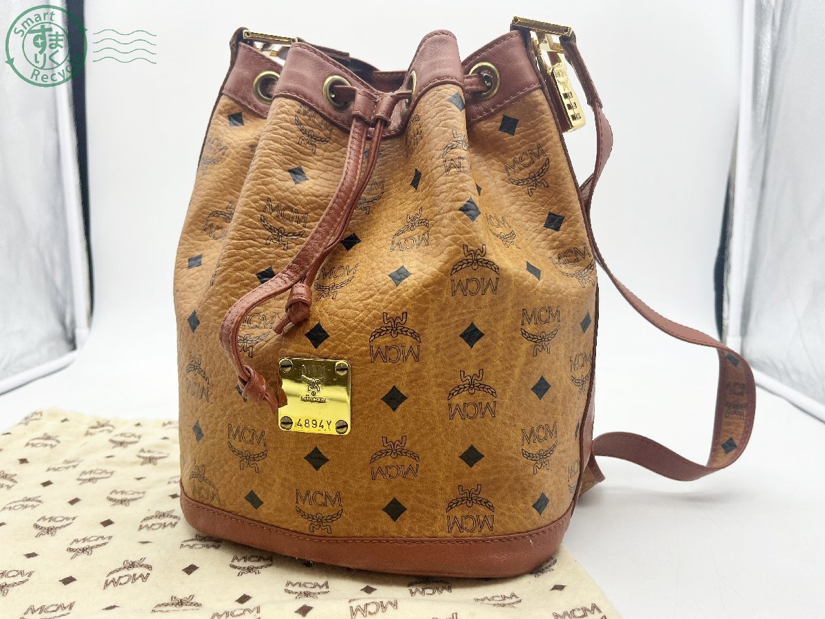11230434 □ MCM モノグラム ヴィセトス柄 レザー 巾着型 肩掛け ショルダー バッグ 鞄 南京錠 保存袋付き ブラウン 中古