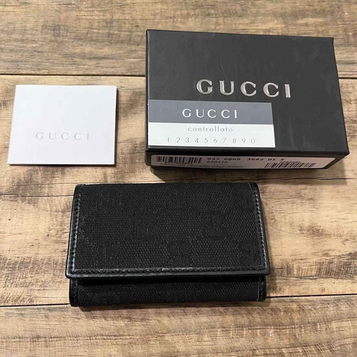 新品！未使用！箱付き！GUCCI グッチ イタリア製 6連 キーケース GC柄 小物 キャンバス レザー 黒 ブラック 正規品 鑑定済み グッチ GUCCI 未使用 ジップアラウンドウォレット 長財布 ハウンド