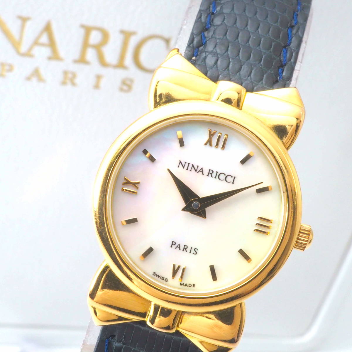 ニナ リッチ ラウンド リボン S953 Cal，980.003 NINA RICCI PARIS クォーツ ゴールド×白シェル ローマン レザー女性，替えベルト[43785-ZG1