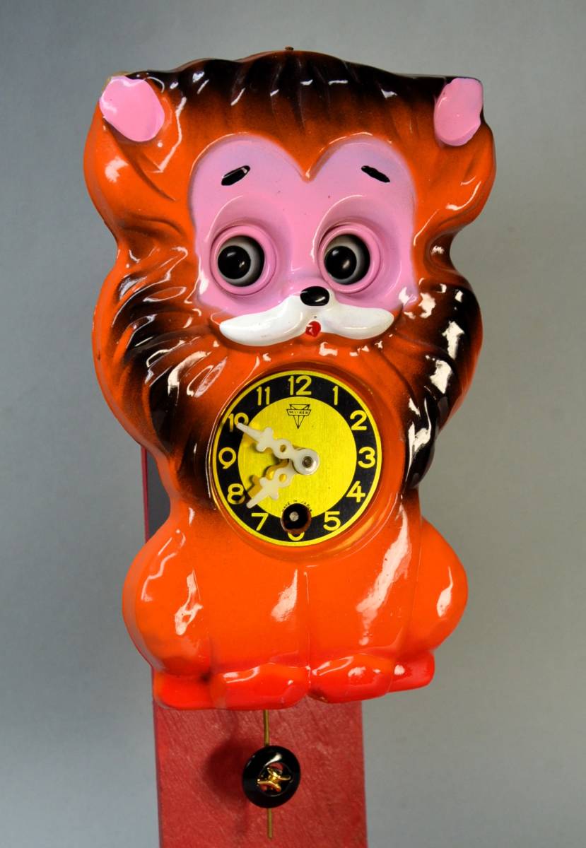 ミケン時計 が1965年頃 販売した ライオンの目玉が動く振り子式掛時計