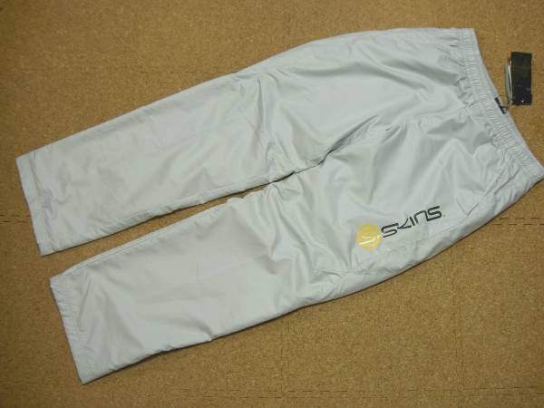 SKINS スキンズ ヒートナビ ウインドPT 新品S定10692円(SAF5403P