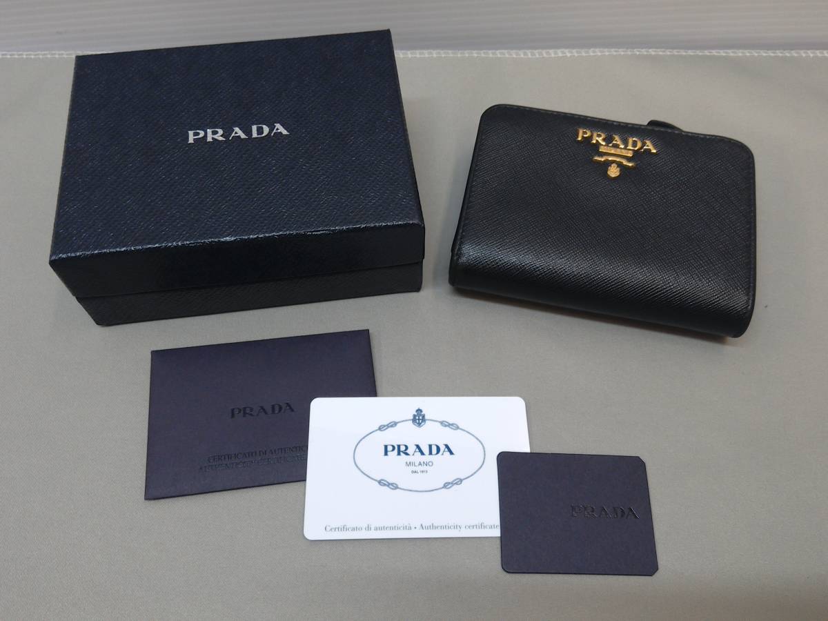  172-y3999-60: プラダ 二つ折り財布 財布 レディース SAFFIANO METAL ブラック 1ML018 QWA F0002 NERO 牛革 サフィアーノメタル(女性用財布)｜売買されたオークション情報、yahooの商品情報をアーカイブ公開 服飾小物