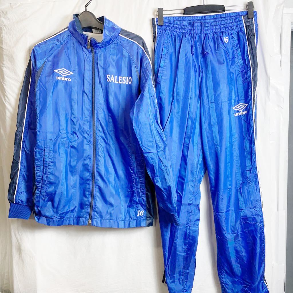 【人気定番，限定SALE】 サレジオ学院 高校サッカー部 支給 着用 アンブロ umbro 青 ブルー 定番シャドー 裏地メッシュ付 ウインドブレーカー上下セット Lサイズ(実使用、サイン入りウエア)｜売買されたオークション 実使用、サイン入りウエア