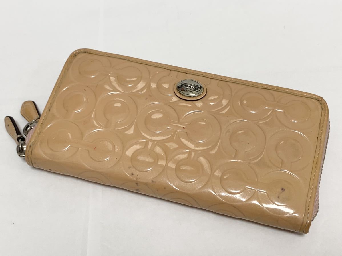 コーチラゥンドファスナーエナメルオレンジ財布 （コーチ COACH 
