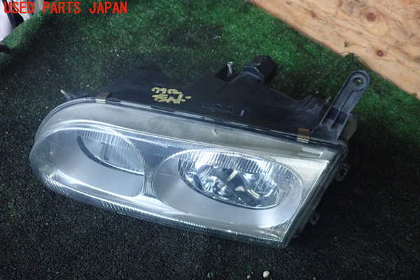 1UPJ-77121132]デリカ スペースギア(PD6W)左ヘッドライト ハロゲン 中古