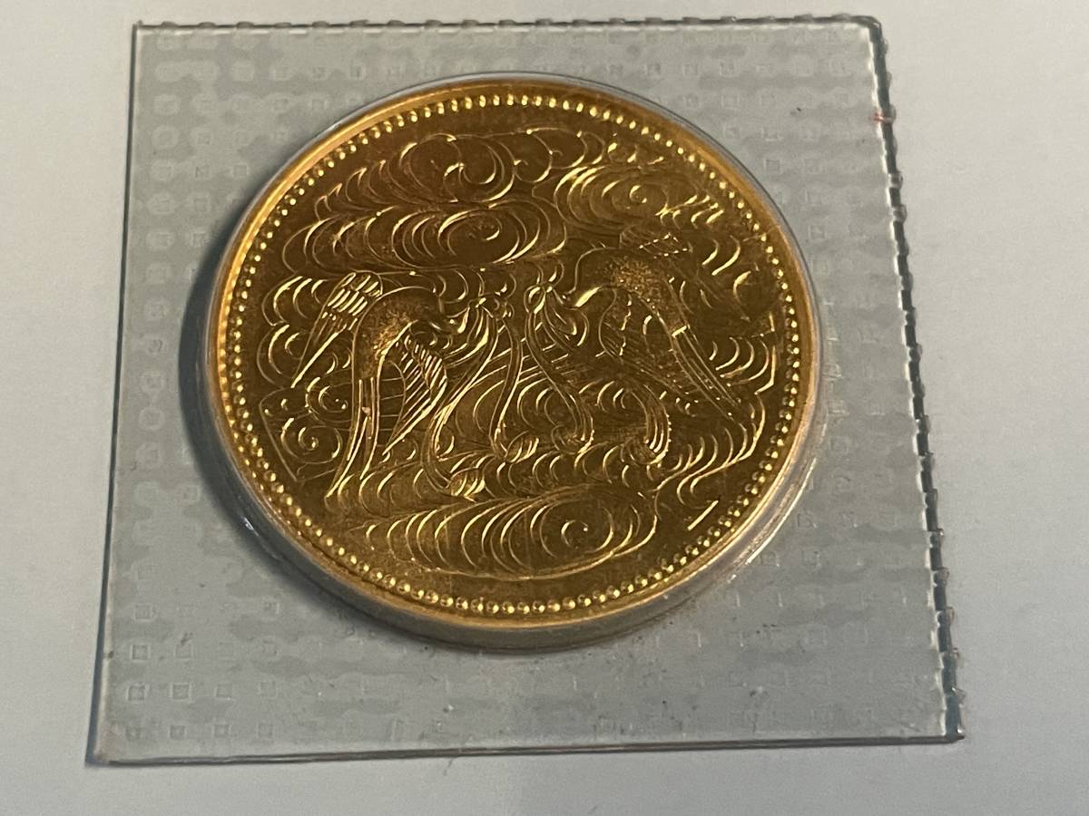 天皇陛下御在位60年記念10万円金貨 