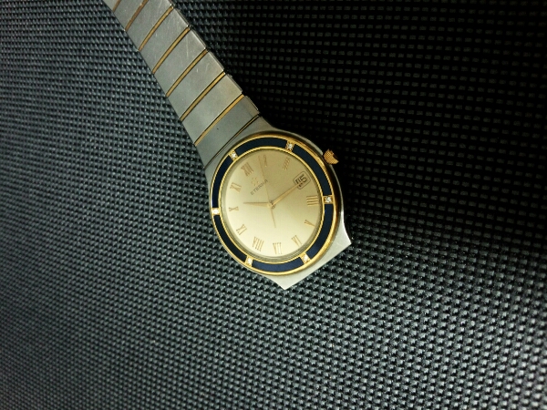 良品・エテルナ・純正６Ｐダイヤベゼル橙文字盤メンズクォーツ！