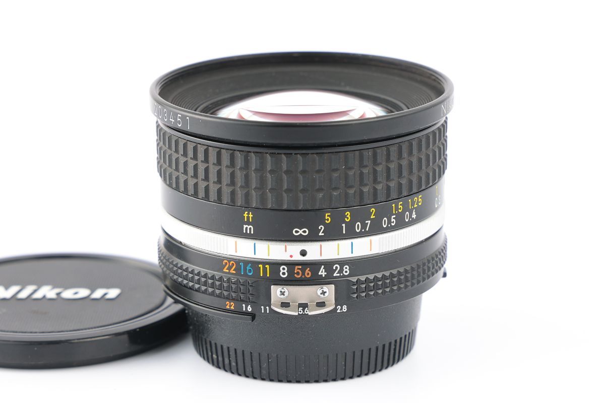 20mm Nikon NIKKOR f⁄2.8 Lens - f⁄4 Manual Focus Nikkor AI AIS Caps