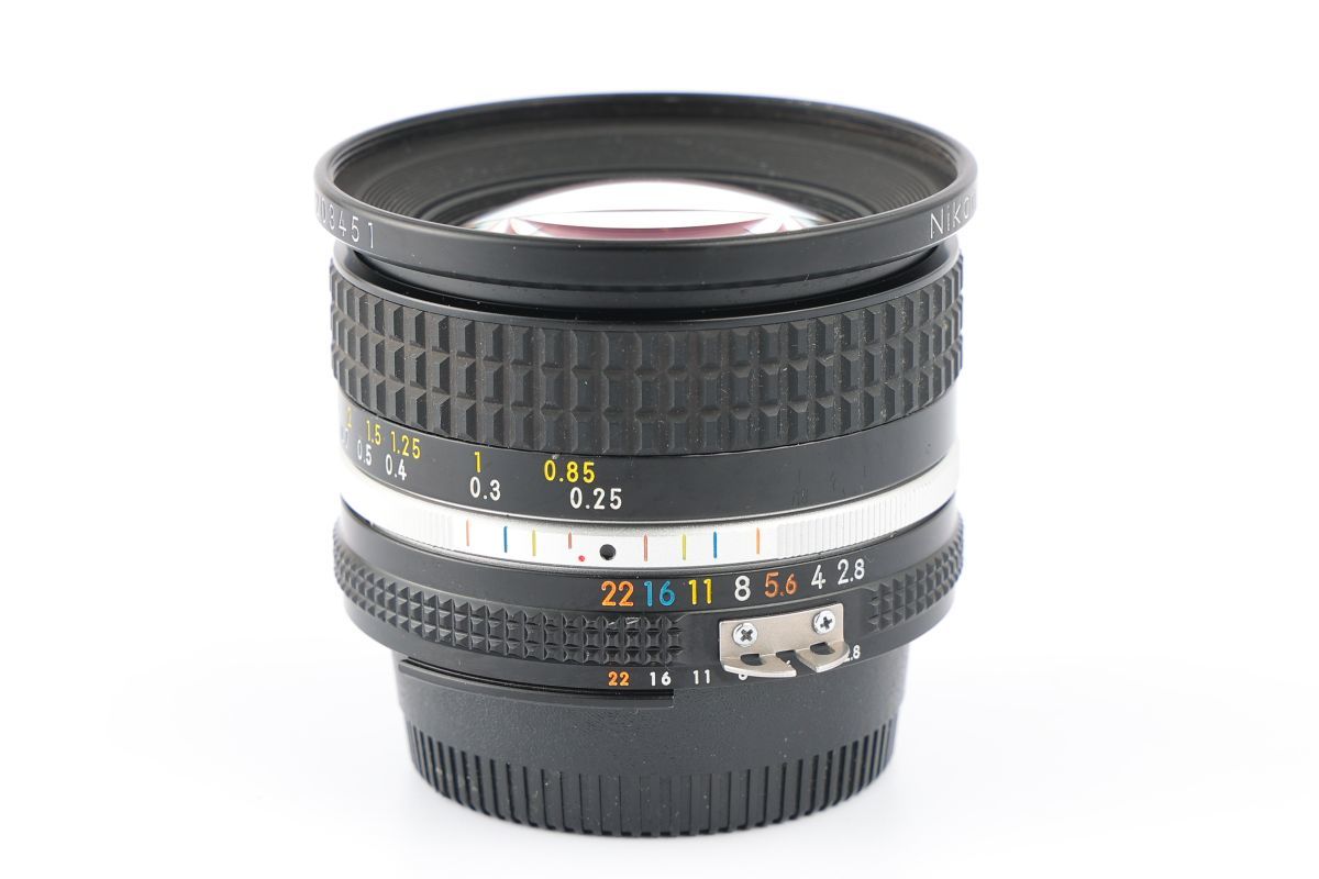 20mm Nikon NIKKOR f⁄2.8 Lens - f⁄4 Manual Focus Nikkor AI AIS Caps