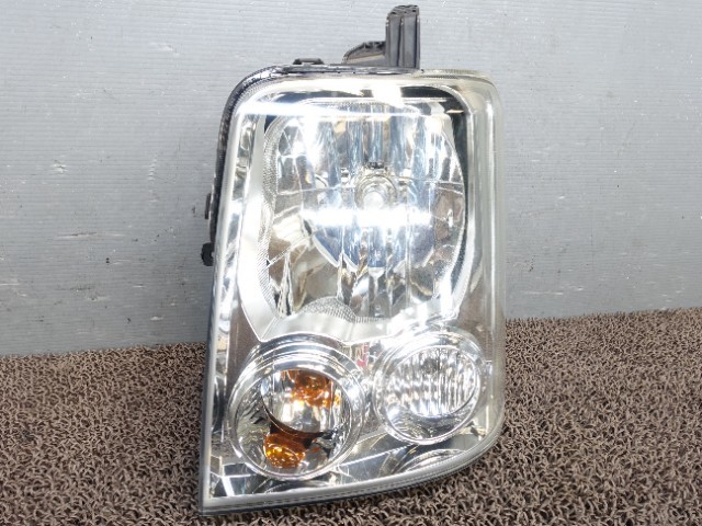 7399　スズキ　エブリィ　DA64W　ヘッドライト左　ヘッドランプ左