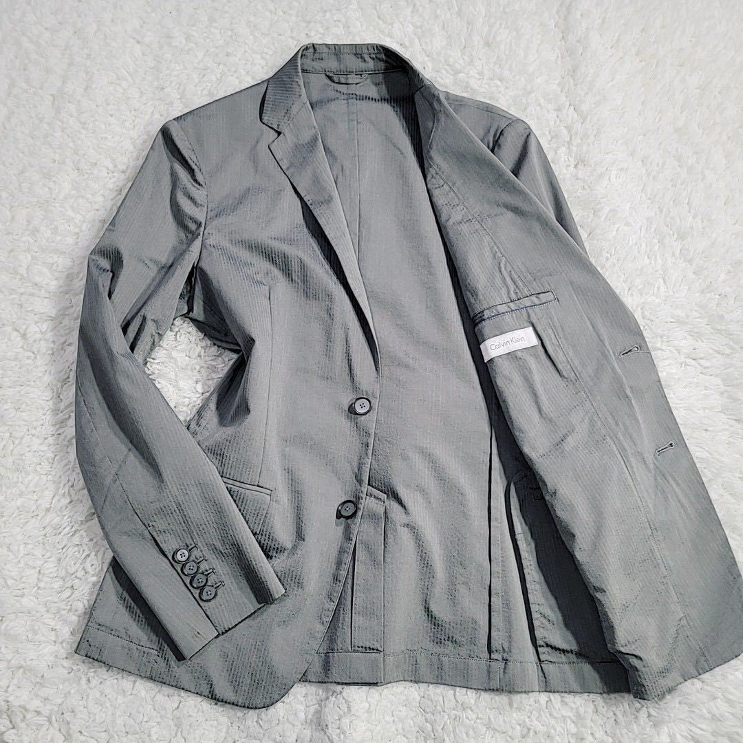 Calvin Klein カルバクライン テーラードジャケット アンコン サマージャケット シャドーストライプ シルバー 2B 背抜き 光沢 おしゃれ M
