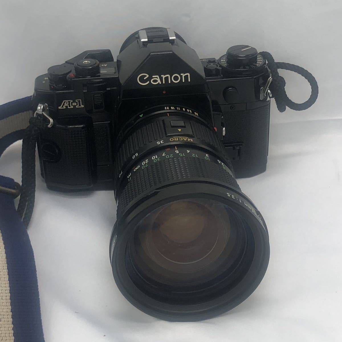 Canon A-1 一眼レフ 一眼レフカメラ キャノン 望遠レンズ35-105mm 電磁式シャッター ストラップ（SPORTS Canon）付き　KH-0OK6