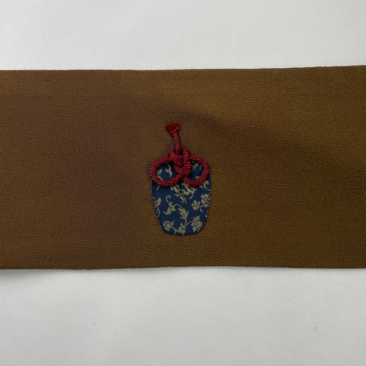 名古屋帯 美品 秀品 お仕覆 縮緬 焦茶色 正絹 【中古】