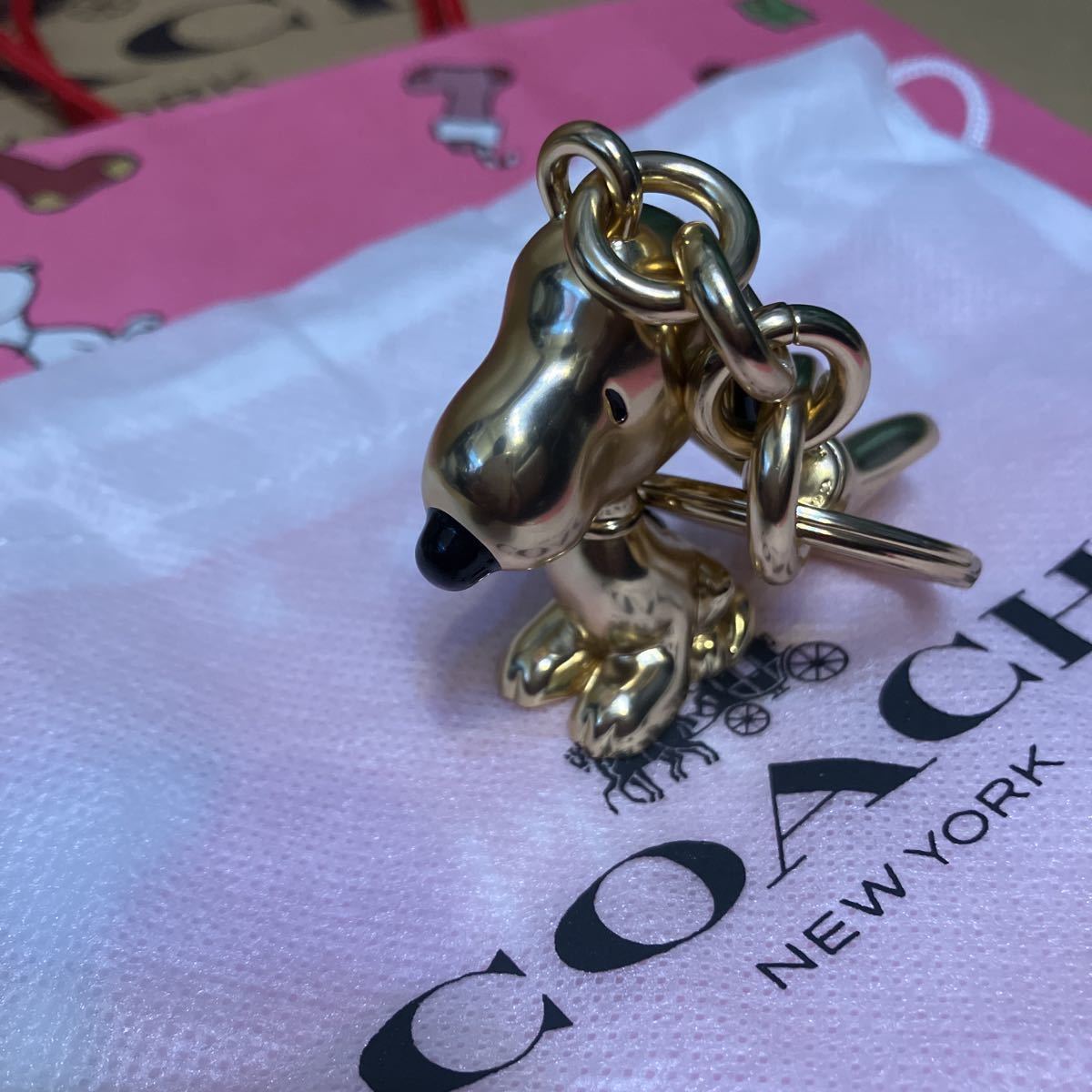 送料込専用袋付○新品○価22000 COACH X PEANUTS スヌーピー ゴールド
