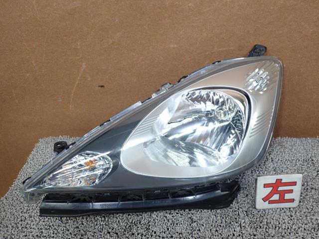 フィット DBA-GE6 左ヘッドライト/左ヘッドランプASSY L13A NH700M