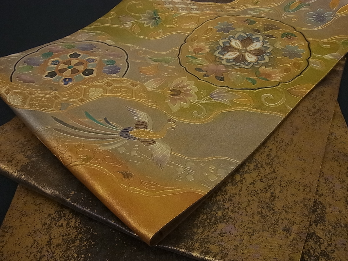 【未使用品】袋帯 螺鈿金彩　鳳凰花唐草　六通　光沢あり 袋帯 金彩 螺鈿 花唐草 お太鼓柄 正絹 金色 華文 名品 正絹｜中古 螺鈿箔