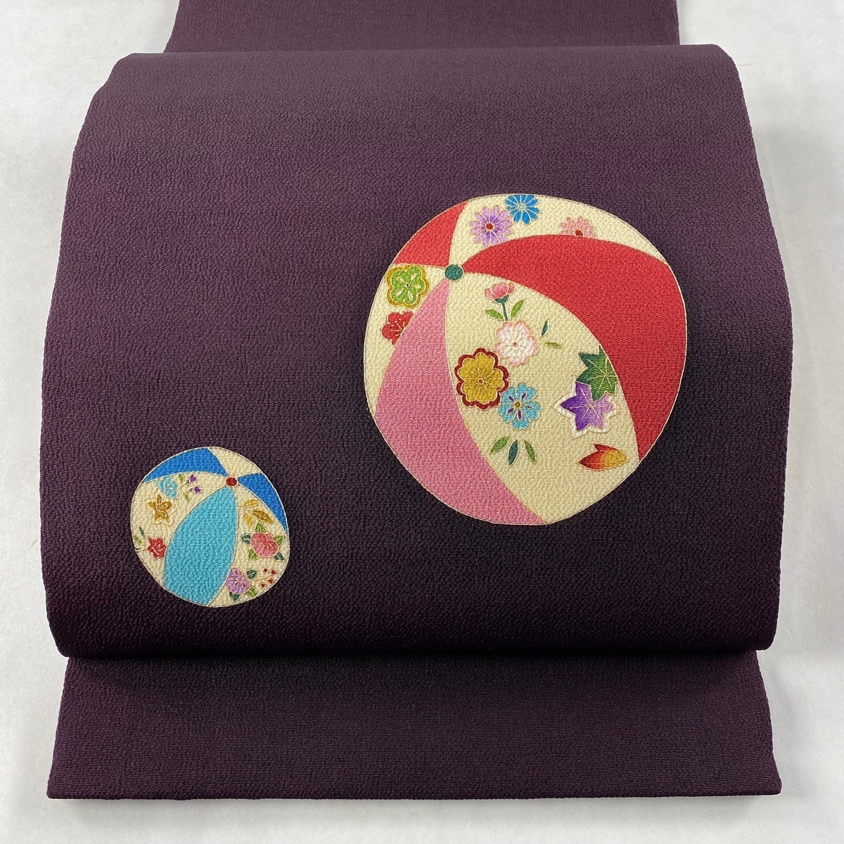 開き名古屋帯 名品 毬 草花 金彩 縮緬 濃紫 正絹 【中古】 名古屋
