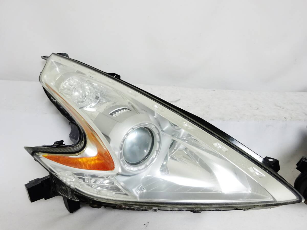 フェアレディZ Z34 磨クリーニング済 群馬県 バージョンST 美品 磨クリーニング済 フェアレディZ Z34 純正 ヘッドライト ヘッドランプ 左右 KOITO 100-63055 HCR-627 ステー欠損無 右 左 ①