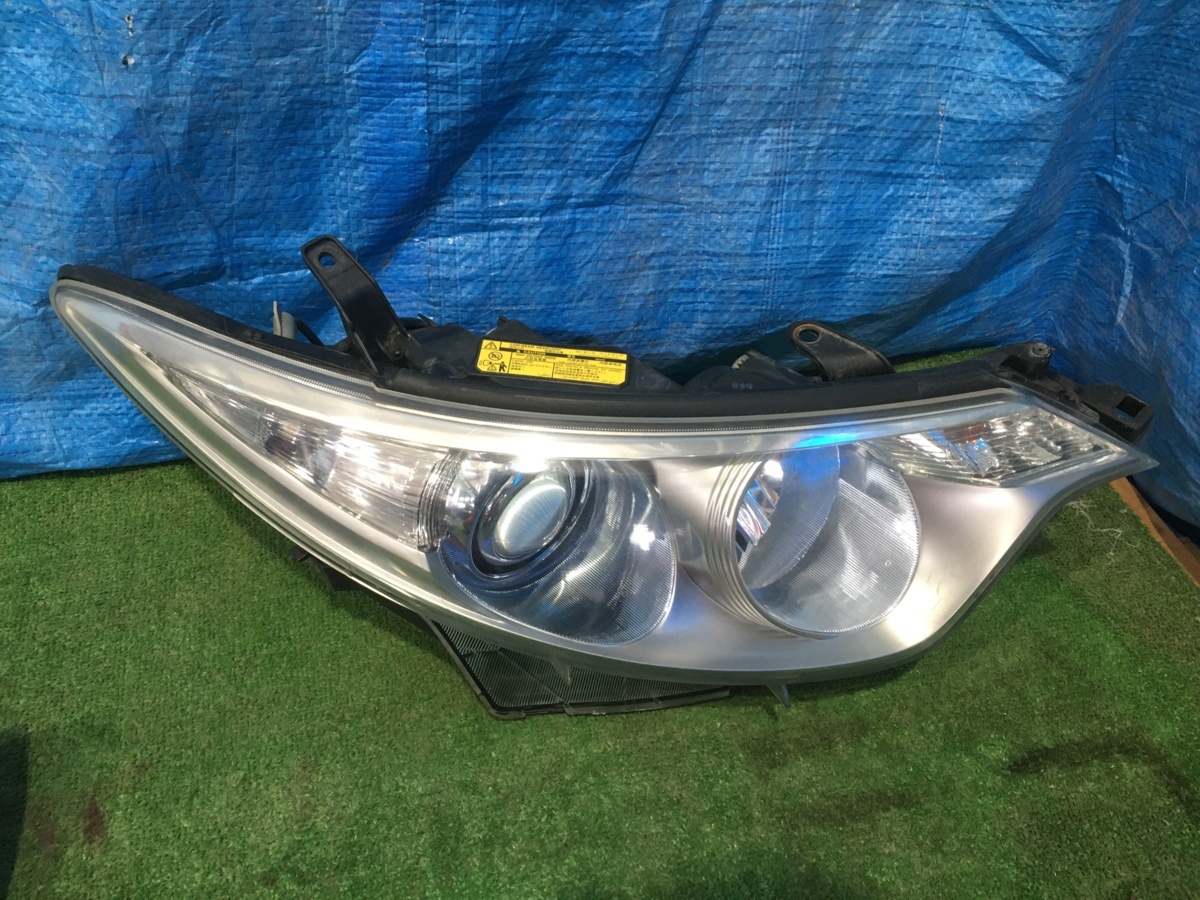 AHR20 エスティマハイブリッド 左ヘッドライト KOITO 28-187 自動車