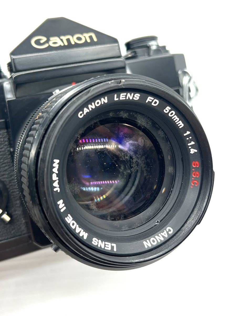 Canon FX 一眼レフ フィルムカメラ （ジャンク品）レザーケース付き 十129] Canon/キャノン/F-1/FD/50mm/1:1.4/S.S.C./ブラックボディ/一眼