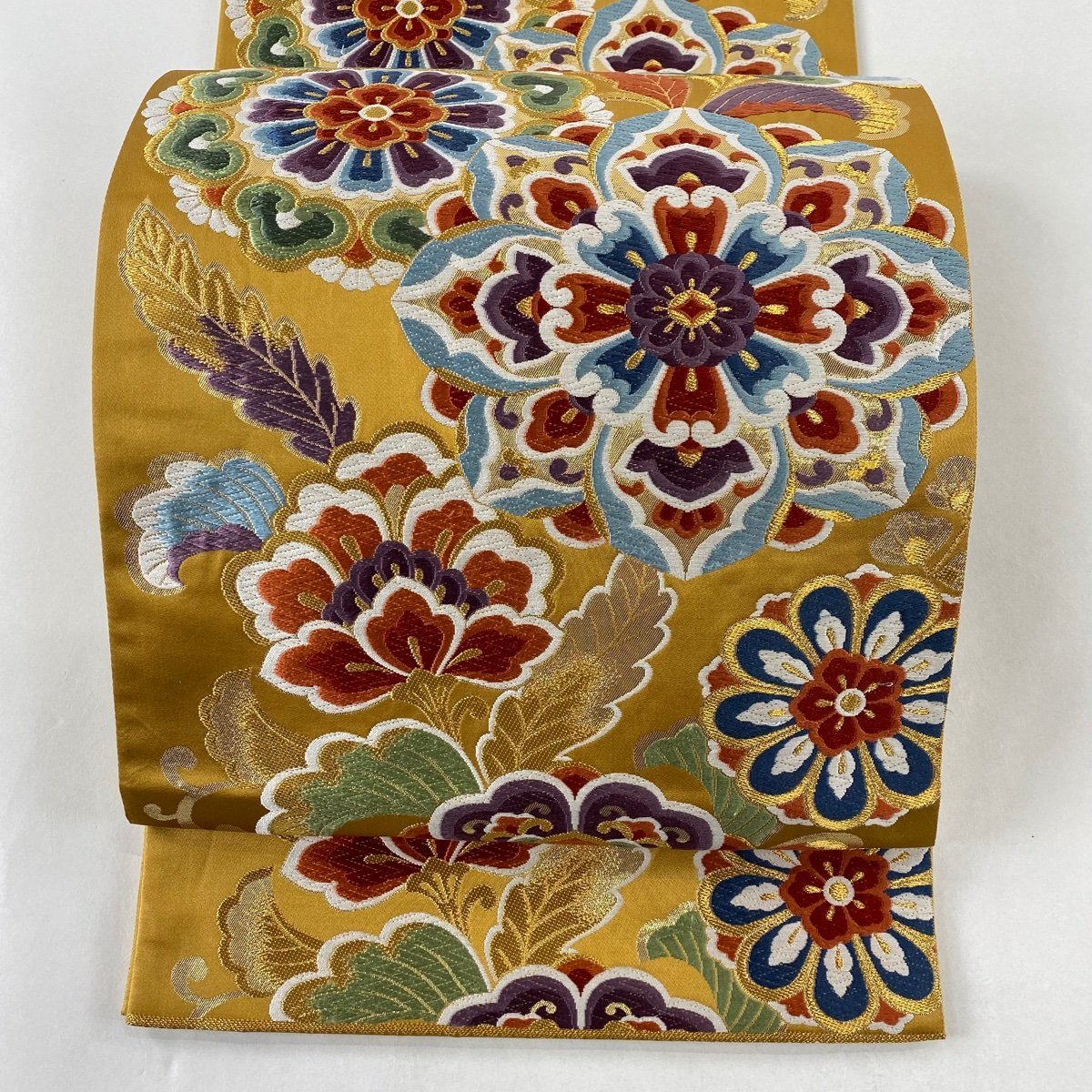 袋帯 美品 秀品 華文 草花 唐織 金糸 山吹茶色 六通 正絹 【中古】